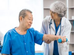 Geriatric Orthopaedics: Optimizing Care for Elderly Patients An elderly man is receiving physical therapy assistance from a female healthcare professional in a medical setting.