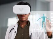 The Integration of Digital Health in Orthopaedic Surgery: What You Need to Know A doctor wearing virtual reality glasses interacts with a holographic medical display showing a human skeleton.