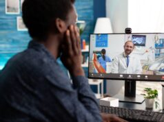 From Clinic to Screen: The Future of Telemedicine in Orthopaedic Practice A person is having a virtual consultation with a doctor via a video call on a computer screen.