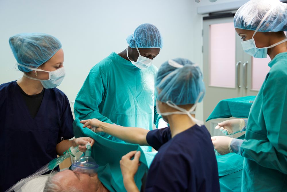 surgical team working on patient in hospital operating room