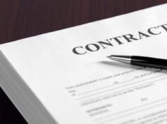 Noncompetes and Contract Clauses: What’s Changing in Orthopaedic Employment Agreements? Contract on desktop