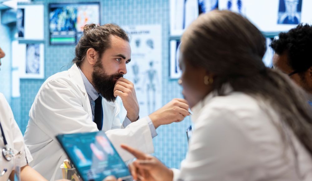 Where Clinical Guidelines Lag Behind Surgical Innovation medical-professionals-in-a-meeting-examining-charts