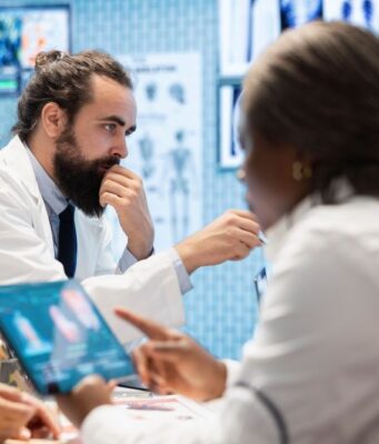 Where Clinical Guidelines Lag Behind Surgical Innovation medical-professionals-in-a-meeting-examining-charts