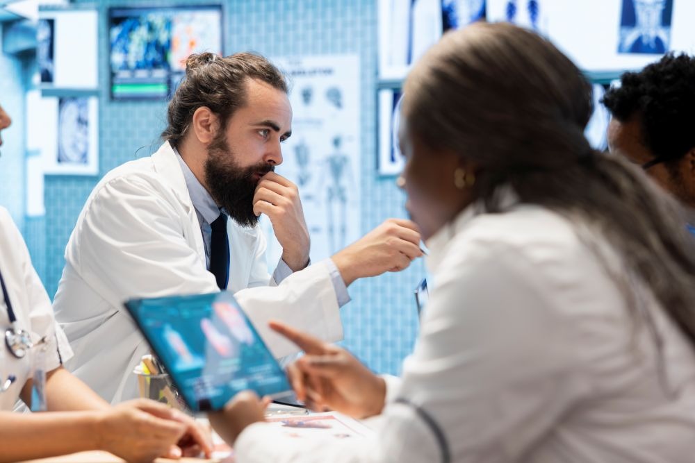 medical-professionals-in-a-meeting-examining-charts